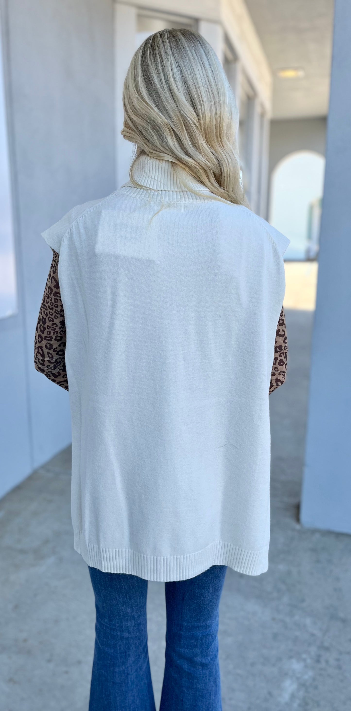 Coconut Milk High Low Sleeveless Turtleneck Sweater