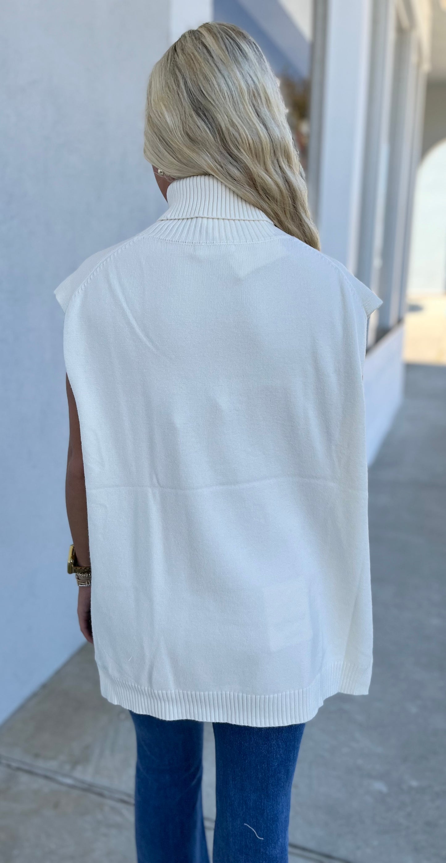 Coconut Milk High Low Sleeveless Turtleneck Sweater