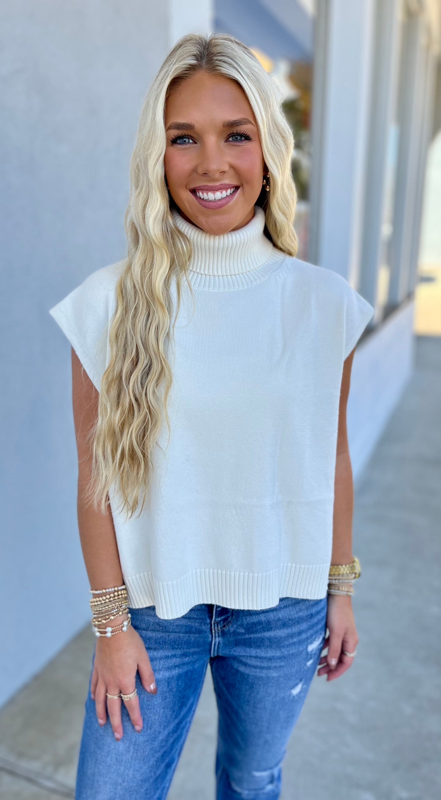 Coconut Milk High Low Sleeveless Turtleneck Sweater